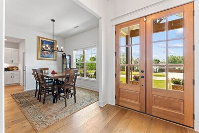 Formal Dining with wide plank wood floors