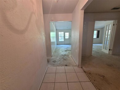 Looking from entry hall into living room with door