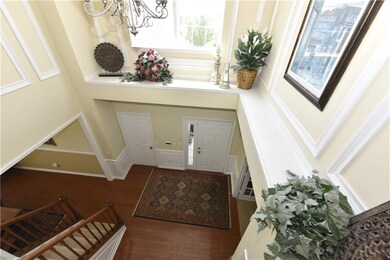 Two story entry with plant shelf. More beautiful molding!