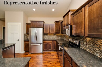 Granite counters, glass tile backsplash.