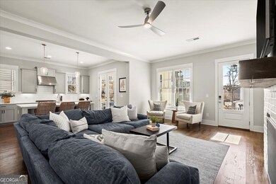 View of Couch and Living Room With Kitchen