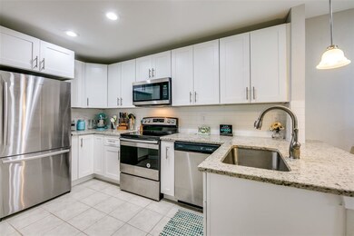 Kitchen is off dining area and open this area