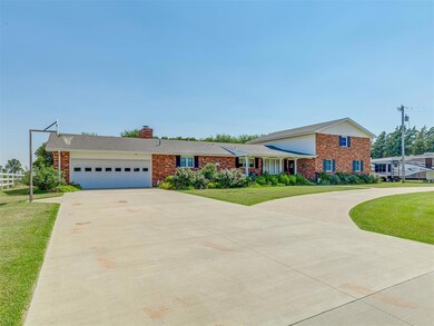 View of front of home featuring a garage and a fro