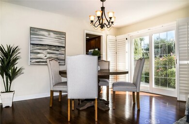 The elegant Dining Room has direct access to kitchen and a sliding door to the patio surrounded by roses.  Great for entertaining or enjoying some indoor or outdoor dining.