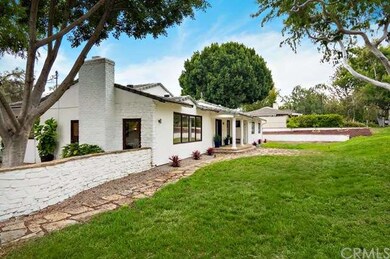 Sprawling yard and stone walk-ways add curb appeal