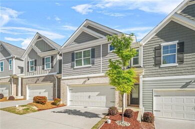 Townhome / multi-family property with a garage, bo