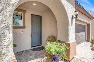 View of exterior entry featuring stucco siding and