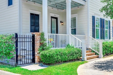 Entrance to property featuring a gate and covered porch