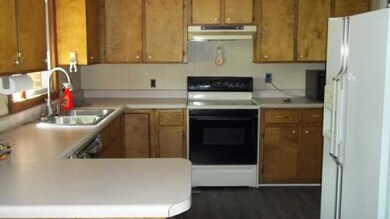 The kitchen is spacious and has lots of counterspace and cabinets. 