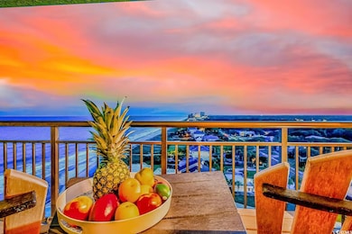 Balcony at dusk featuring a water view