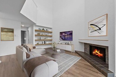 Living room with a towering ceiling, wood finishe