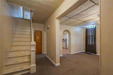 Large entryway with original banister!