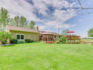 This brick ranch resides on 4.38 acres in Louisville CSD.