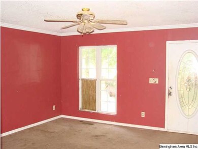 Living room with front door on right