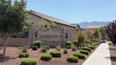 Community / neighborhood sign with a mountain view