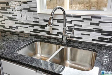 Granite counters, tile backsplash and stainless ap