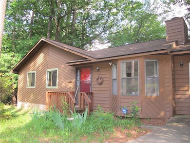 View of front of home featuring a chimney