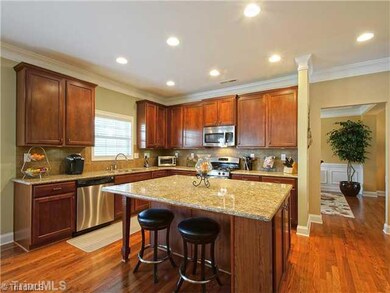 Kitchen. A gourmet s delight, you re going to love this kitchen. Features include granite tops, abundant cabinets, a huge island with eating bar, and a pantry.