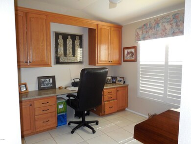 Office with built-in cabinets & desk
