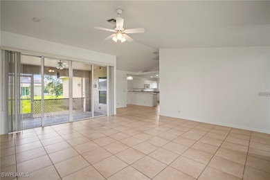 Spare room featuring ceiling fan, vaulted ceiling,