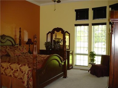 This master suite is over the top. Features tall curved windows opeing to the private back patio. Full bath with double vanities, tiled shower, whirlpool tub and walk-in closet