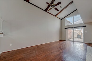 This spacious living area features high vaulted ce