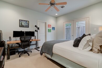 A spacious first floor guest bedroom offers access