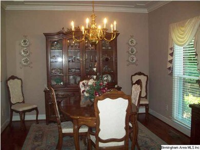 Elegant Formal Dining Room with gleaming hardwoods
