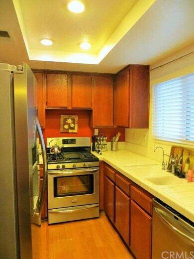 Efficient galley kitchen with window, tile counter