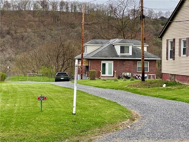 Sits back from road, behind another property