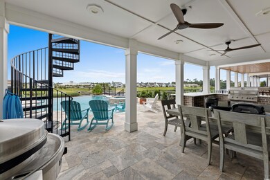 View of patio / terrace featuring stairway, ceiling fan, a pool with connected hot tub, and outdoor dining space