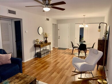 Living room featuring light hardwood / wood-style 