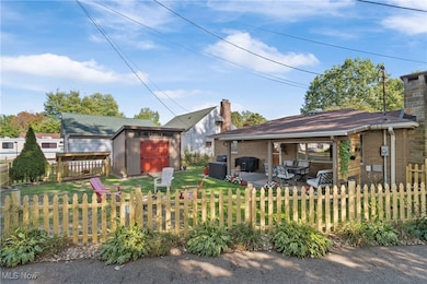 Side/ back view of home and yard area