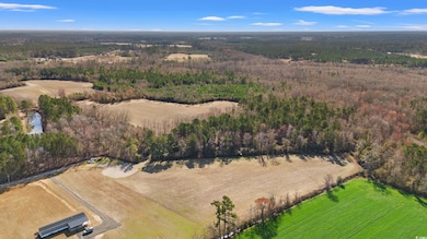 Birds eye view of property with a rural view