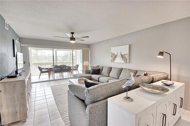 Tiled living room featuring a textured ceiling and