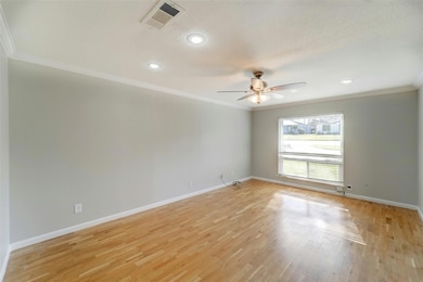 Empty room featuring ceiling fan, baseboards, orn