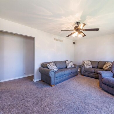 Living room with hallway to the bedrooms
