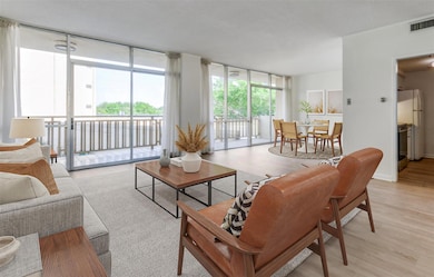 Living-dining area opens to balcony (virtually sta