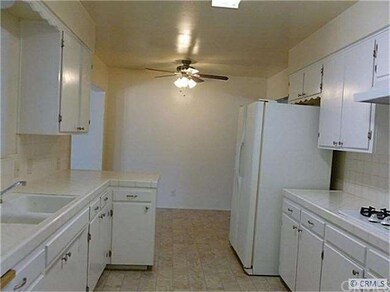Kitchen with dining area behind