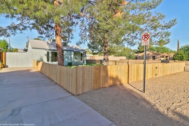 Front of home w new wood fence