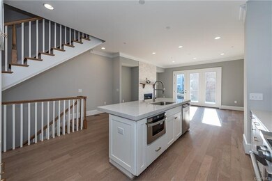 Kitchen island has microwave drawer, upgraded hard