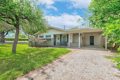 Single story home with driveway, a porch, a front
