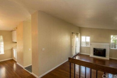 Living room with fireplace and French doors to bac