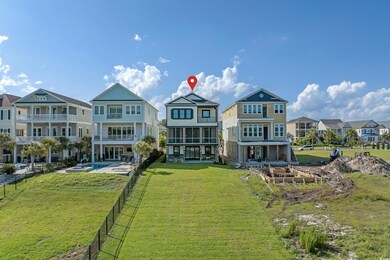 Rear view of property featuring a residential view, a pool with connected hot tub, and a patio