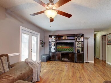 Nice size living room with French doors leading ou