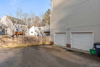a 2 1/2 car oversized garage with access to the ba