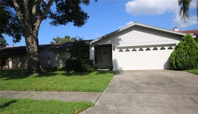 Front View Of This Largo Home With a Two Car Garag