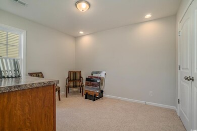 Living area featuring carpet flooring
