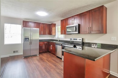 Kitchen featuring appliances with stainless steel 