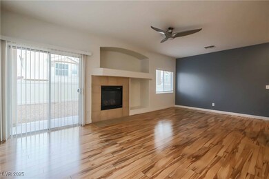 Unfurnished living room with ceiling fan, light wo